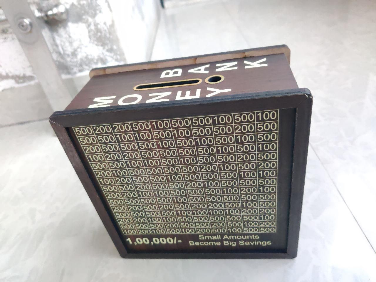 Wooden saving box.